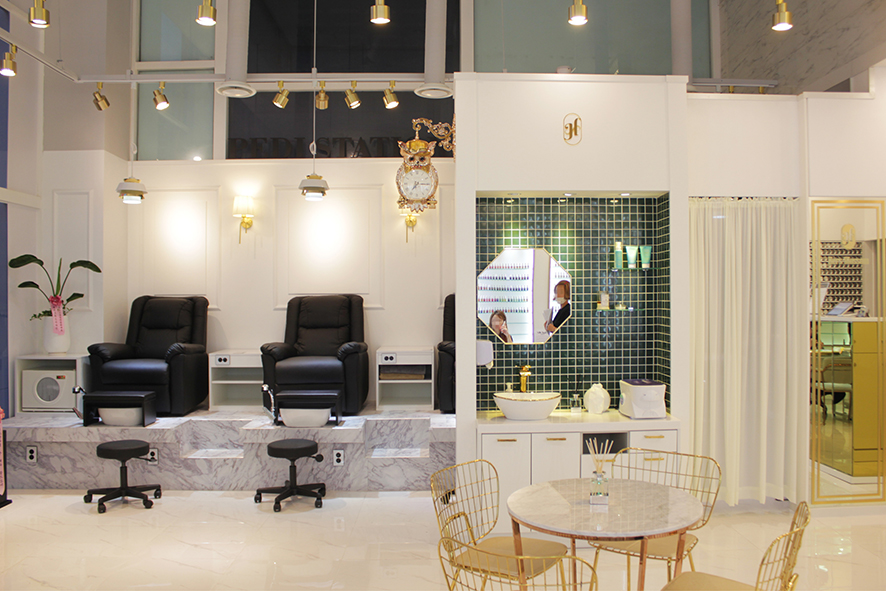 » White marble and gold frame Style Nail salon interior by MAKEWITH
