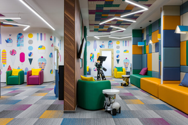 Waiting area adjoining reception, with seating along the wall.